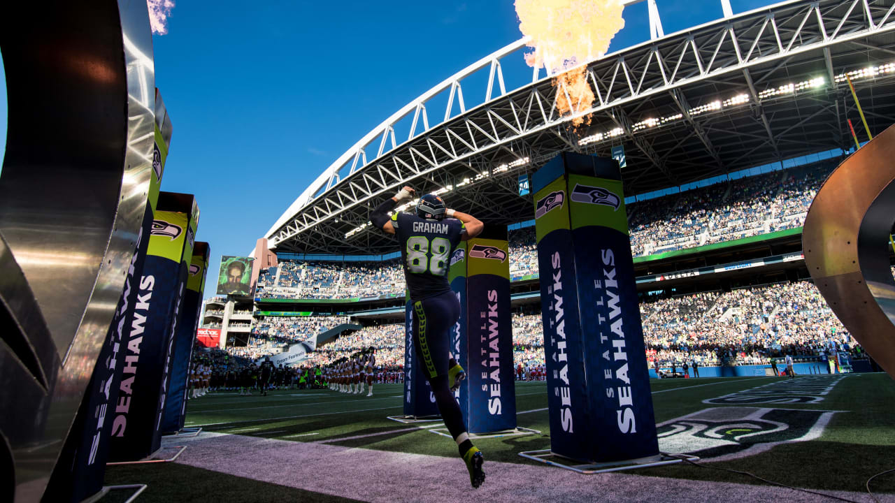 Seattle Seahawks John L. Williams (32) looses the ball as he tried jumping  over the line in the third quarter of the NFC playoff game in Houston,  Texas., Sunday, Jan. 4, 1988.