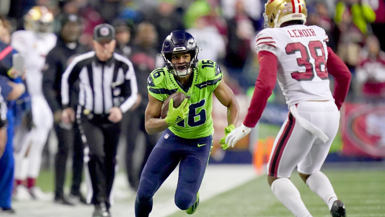 Wide receiver Tyler Lockett of the Seattle Seahawks smiles between