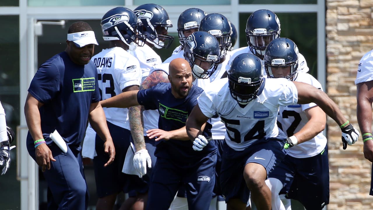 Seahawks defensive coodinator Kris Richard makes a tough phone