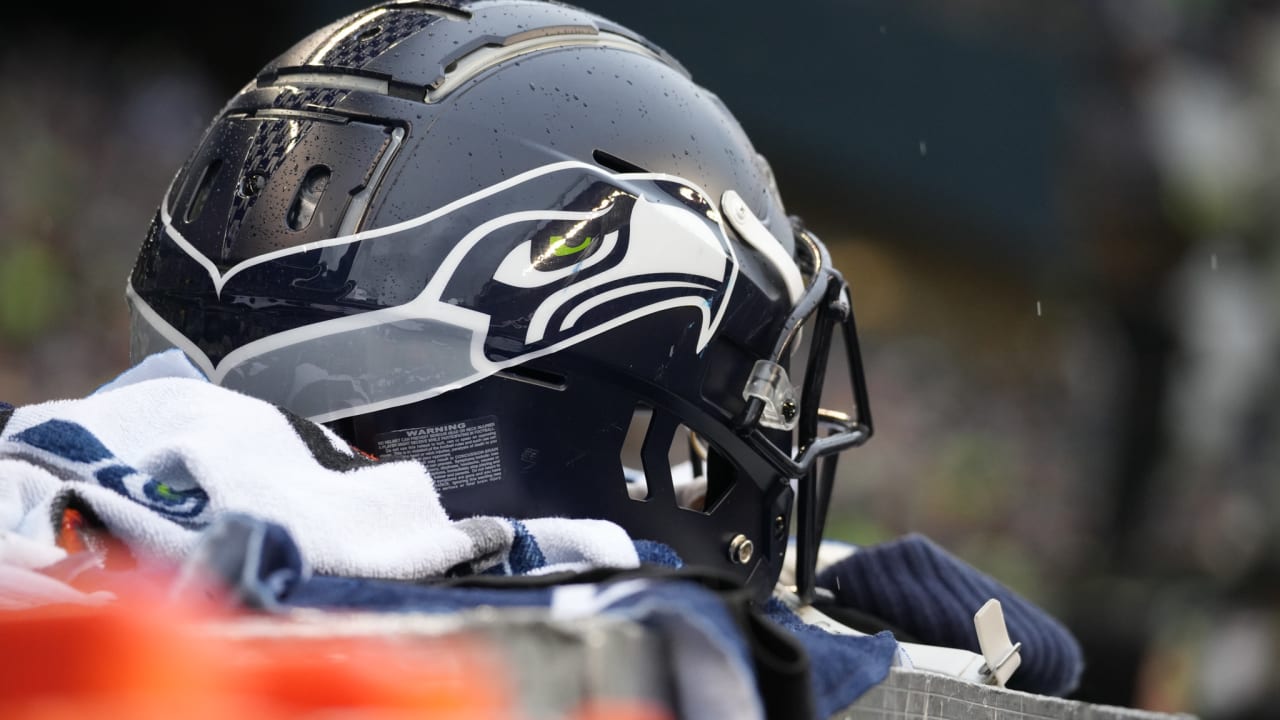 Seattle Seahawks cornerback Chris Steele holds a football during