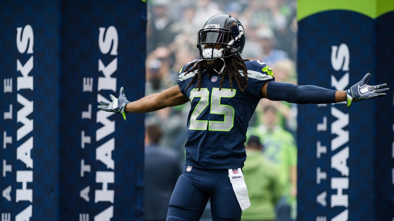 Seattle Seahawks cornerback Richard Sherman wears a mask to stay warm  during warmups before an NFL football game against the Los Angeles Rams,  Thursday, Dec. 15, 2016, in Seattle. (AP Photo/Elaine Thompson