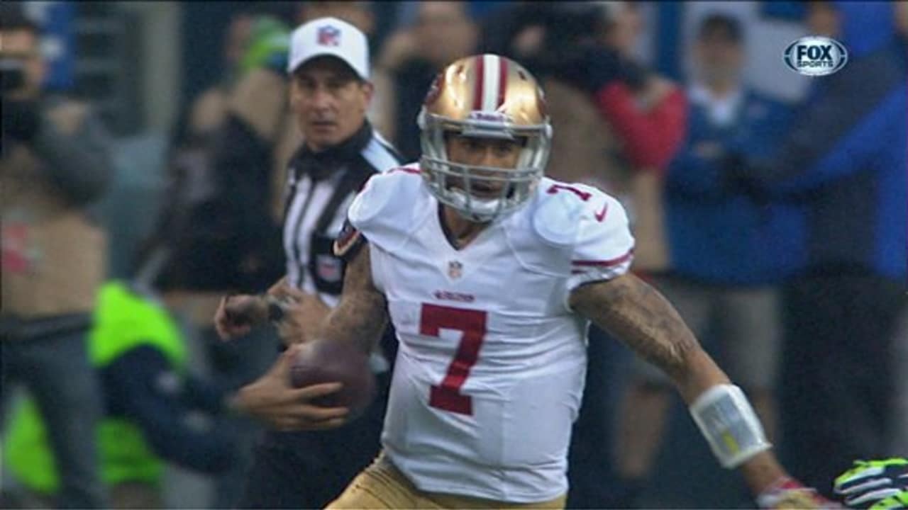 San Francisco 49ers QB Colin Kaepernick (7) scrambles for nine yards  pursued by Seattle Seahawks Bobby Wagner (54) in the first quarter at  Candlestick Park on in San Francisco on December 8