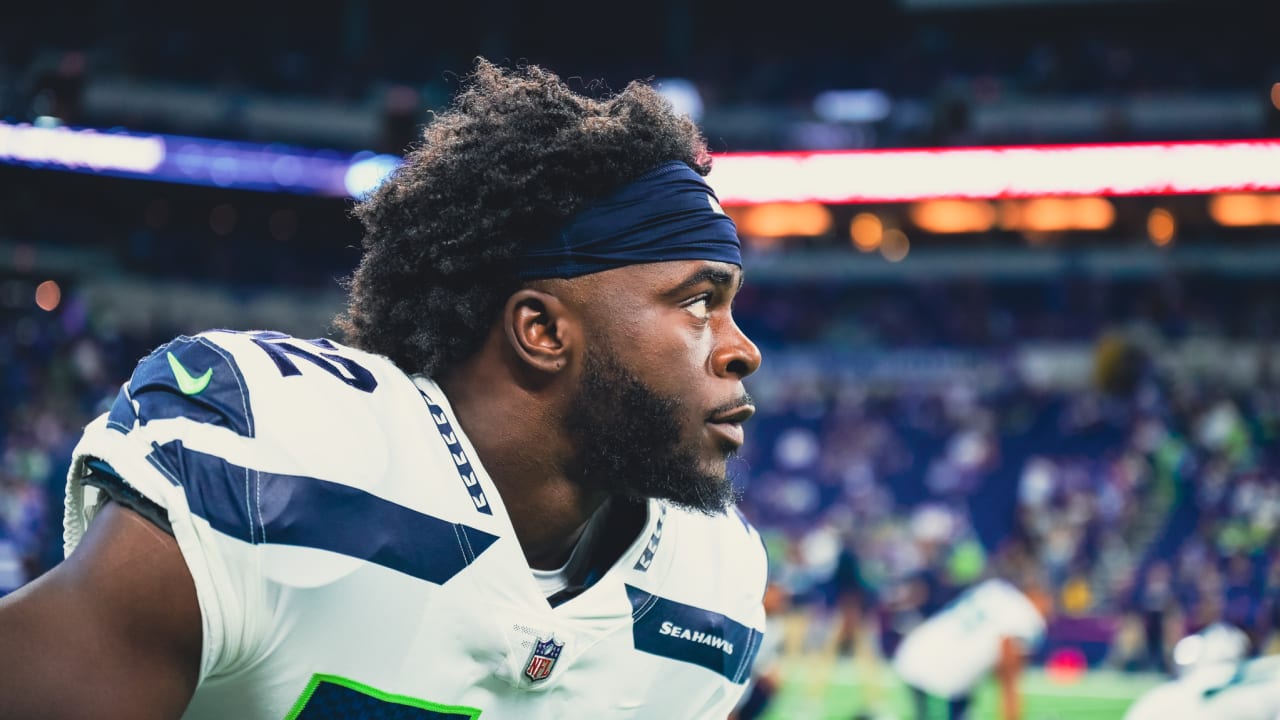 Seahawks LB Darrell Taylor runs onto the field after an