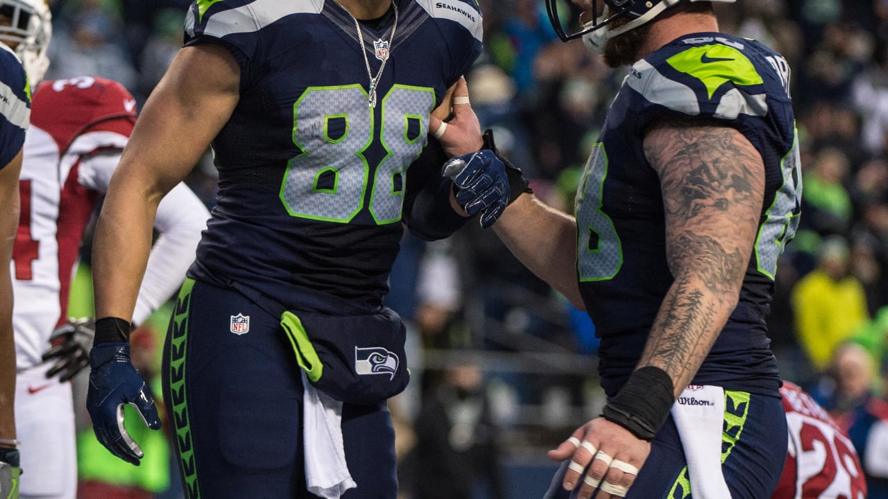 Washington Redskins halfback Chris Cooley is tackled by Seattle Seahawks  strong safety Michael Boulware in the second quarter during their NFC  divisional playoff football game in Seattle, Saturday, Jan. 14, 2006. (AP