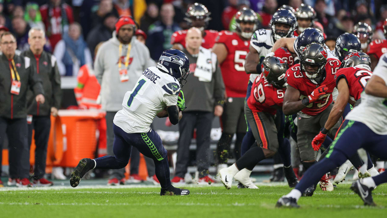 Seattle Seahawks wide receiver D'Wayne Eskridge (1) runs with the ball  during the second half of an NFL football game against the Green Bay  Packers, Sunday, Nov. 14, 2021, in Green Bay