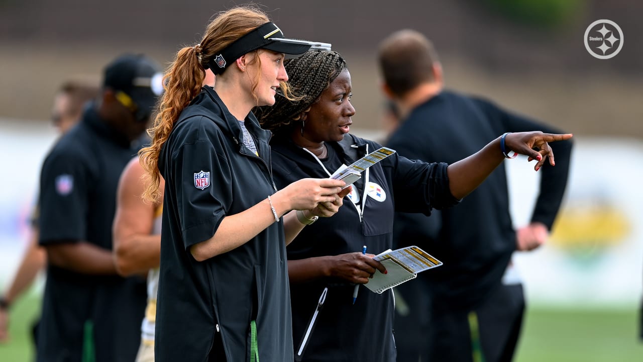 Pittsburgh Steelers trainer Ariko Iso watches a game replay on the