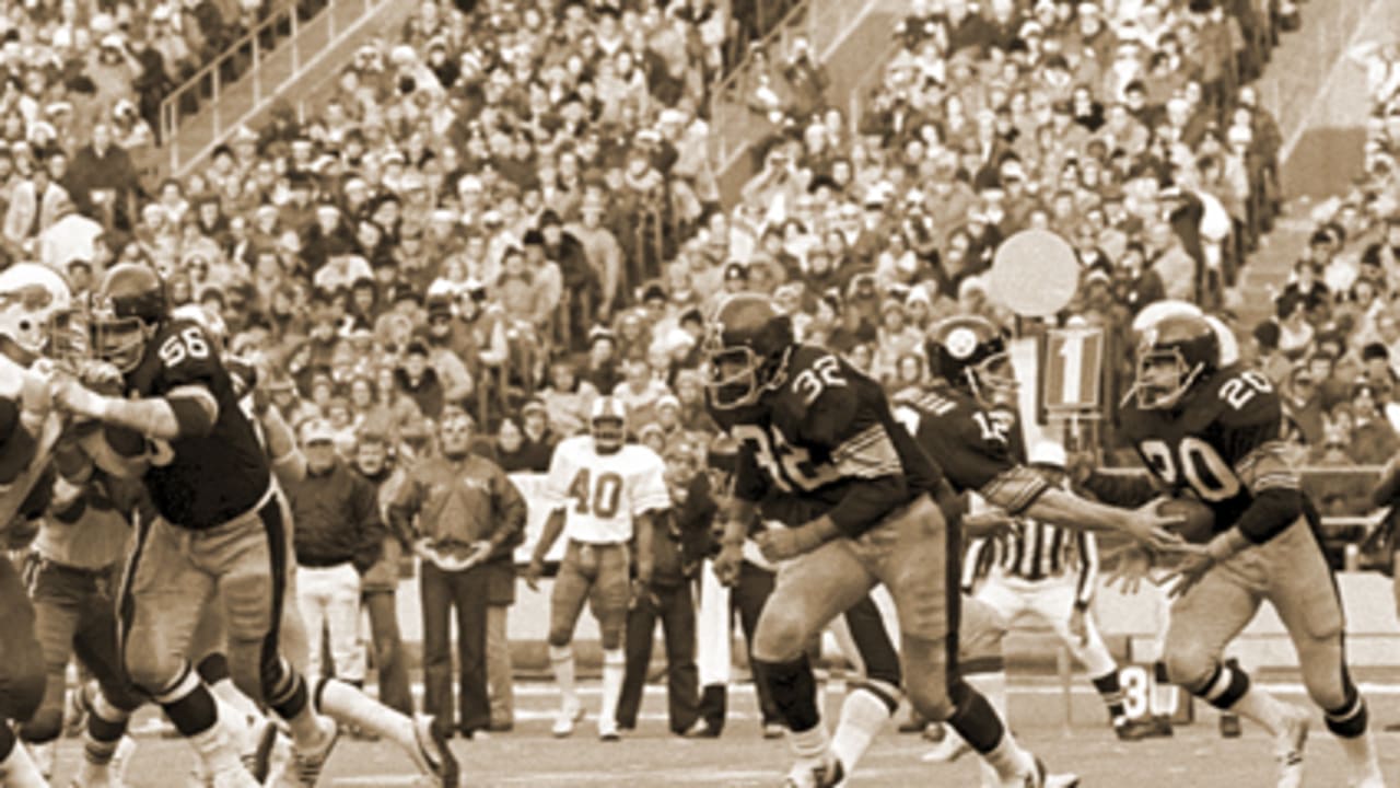 Pittsburgh Steelers Hall of Famers Franco Harris, left, and Terry Bradshaw,  12, and running back Rocky Bleier, 20, are honored at half-time of a NFL  football game against the Baltimore Ravens as