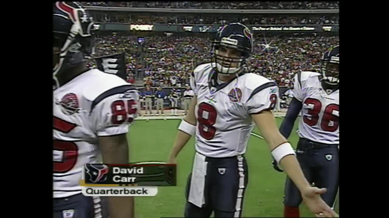 HOUP2002090801 - Houston, Sept. 8, (UPI) -- Houston Texans quarterback  David Carr (8) tries to escape the Dallas Cowboys defense during the 2nd  quarter on Sept. 8, 2002, in Houston. The Texans