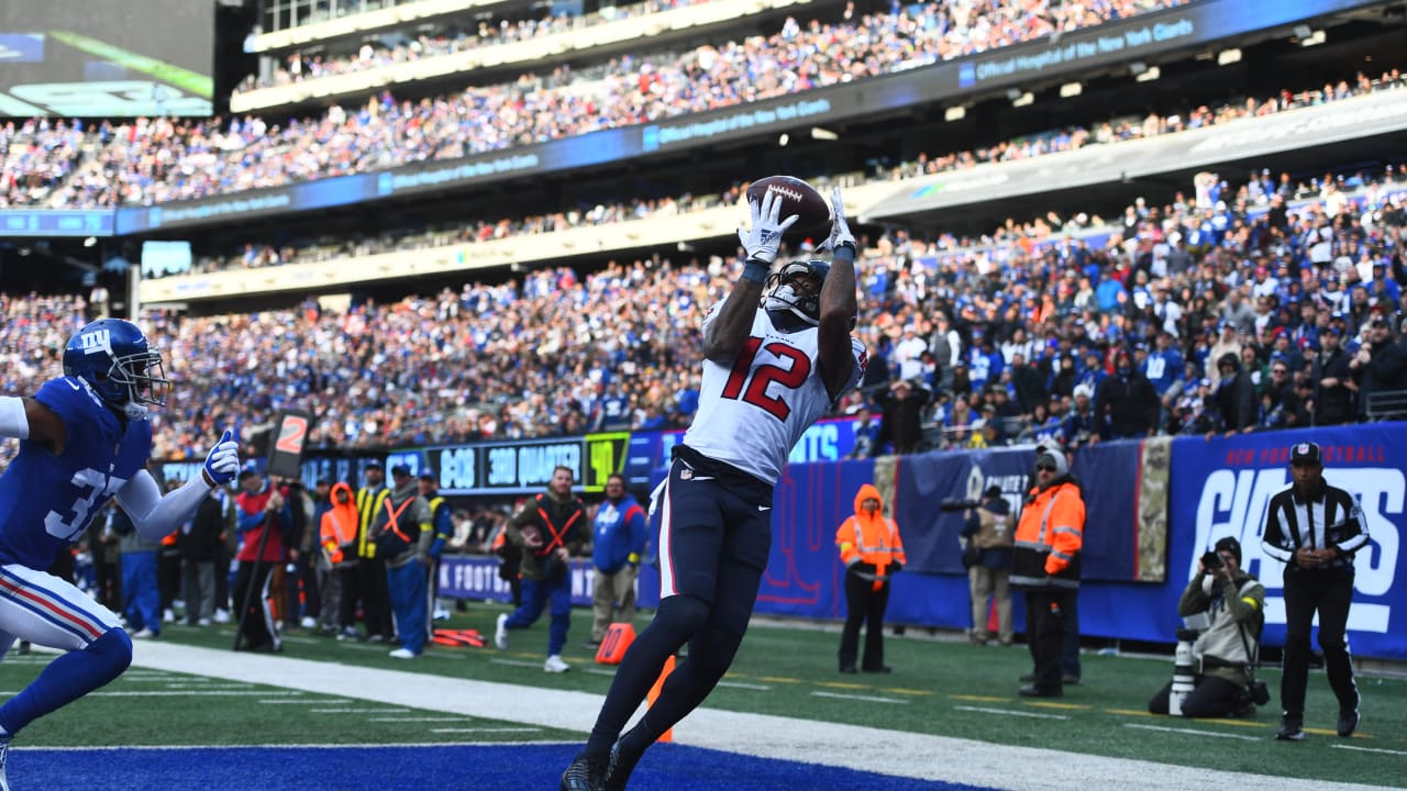 January 9, 2022: Houston Texans wide receiver Nico Collins (12) carries the  ball after a catch during an NFL game between the Texans and the Titans on  Jan. 9, 2022 in Houston