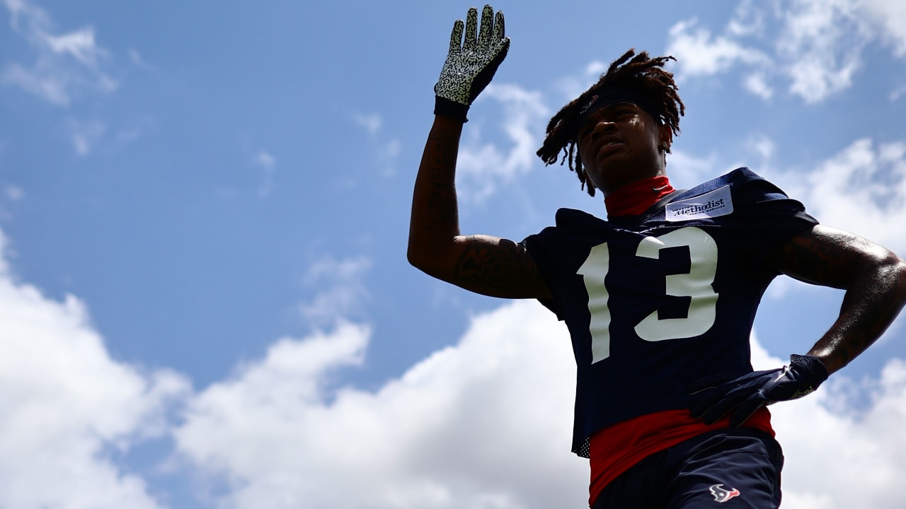 Houston Texans wide receiver Tank Dell makes his way to the field