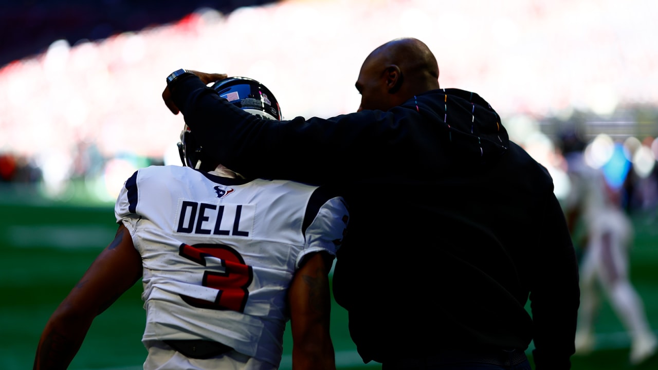 Houston Texans wide receiver Tank Dell runs after a catch against