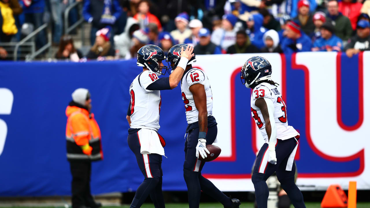 Houston Texans wide receiver Nico Collins (12) carries the ball after a  reception during an NFL football game against the Tennessee Titans, Sunday,  Jan. 9, 2022, in Houston. (AP Photo/Matt Patterson Stock