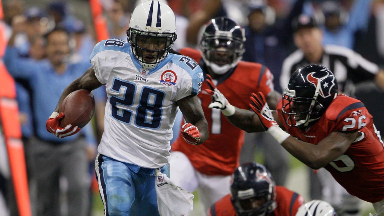 Tennessee Titans running back Chris Johnson (28), left, celebrates