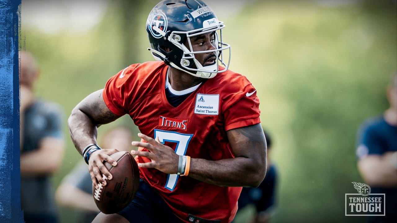 Tennessee Titans quarterback Malik Willis locates wide receiver Chris Moore  on first pass of the day for 30-yard gain