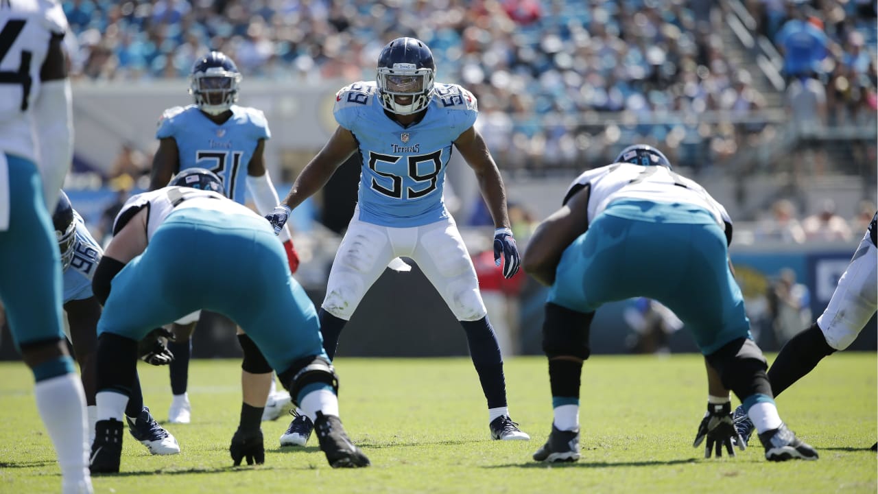 Jacksonville Jaguars linebacker Travon Walker (44) tackles Tennessee Titans  running back Derrick Henry in the second half of an NFL football game,  Saturday, Jan. 7, 2023, in Jacksonville, Fla. (AP Photo/John Raoux