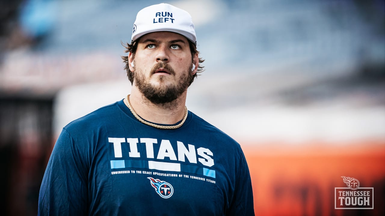 Taylor Lewan of the Tennessee Titans watches a replay during a