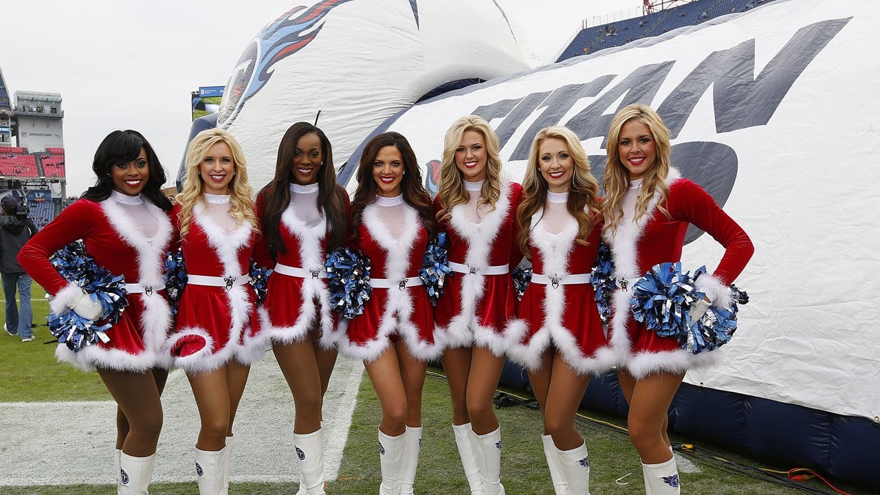 Dallas Cowboys cheerleader performs at halftime in her Santa Claus