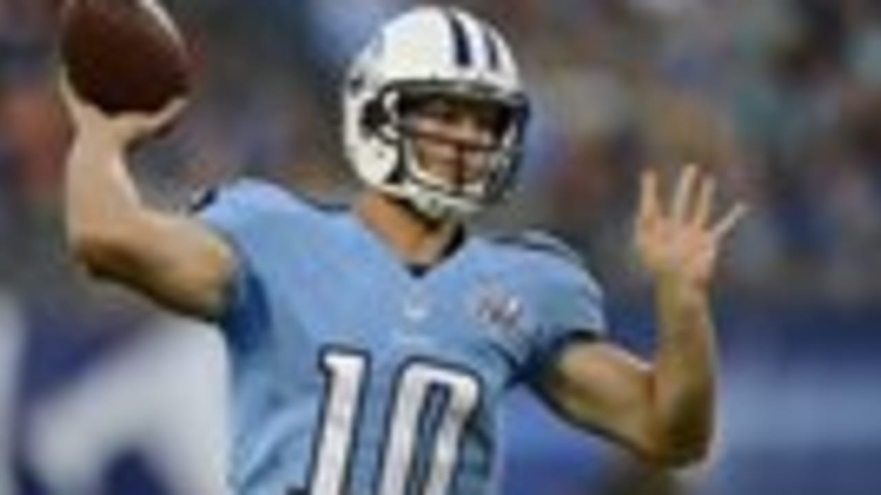 Tennessee Titans quarterback Jake Locker (10) scrambles against