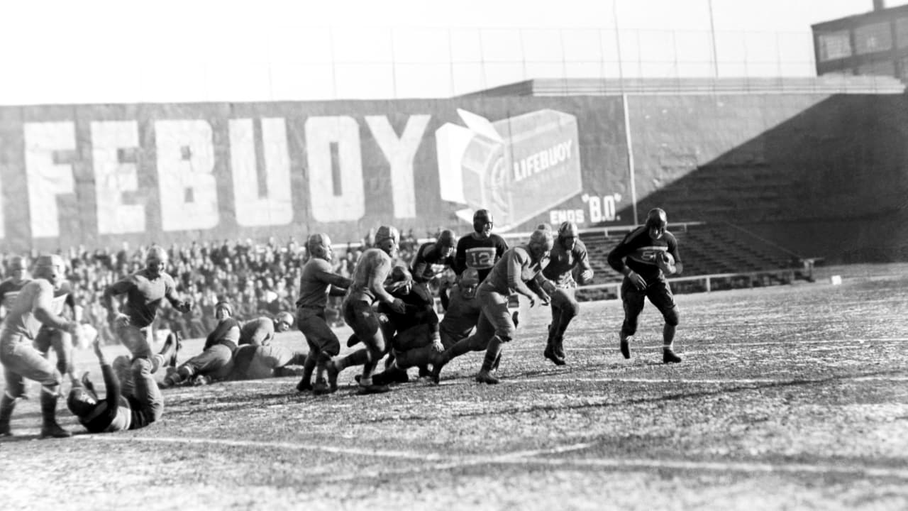 New Philadelphia Eagles' wide receiver Gary Ballman (85) goes down under  onslaught of New York Giants' safety Spider Lockhart (43) as the Giants'  defense man broke up a pass attempt in first