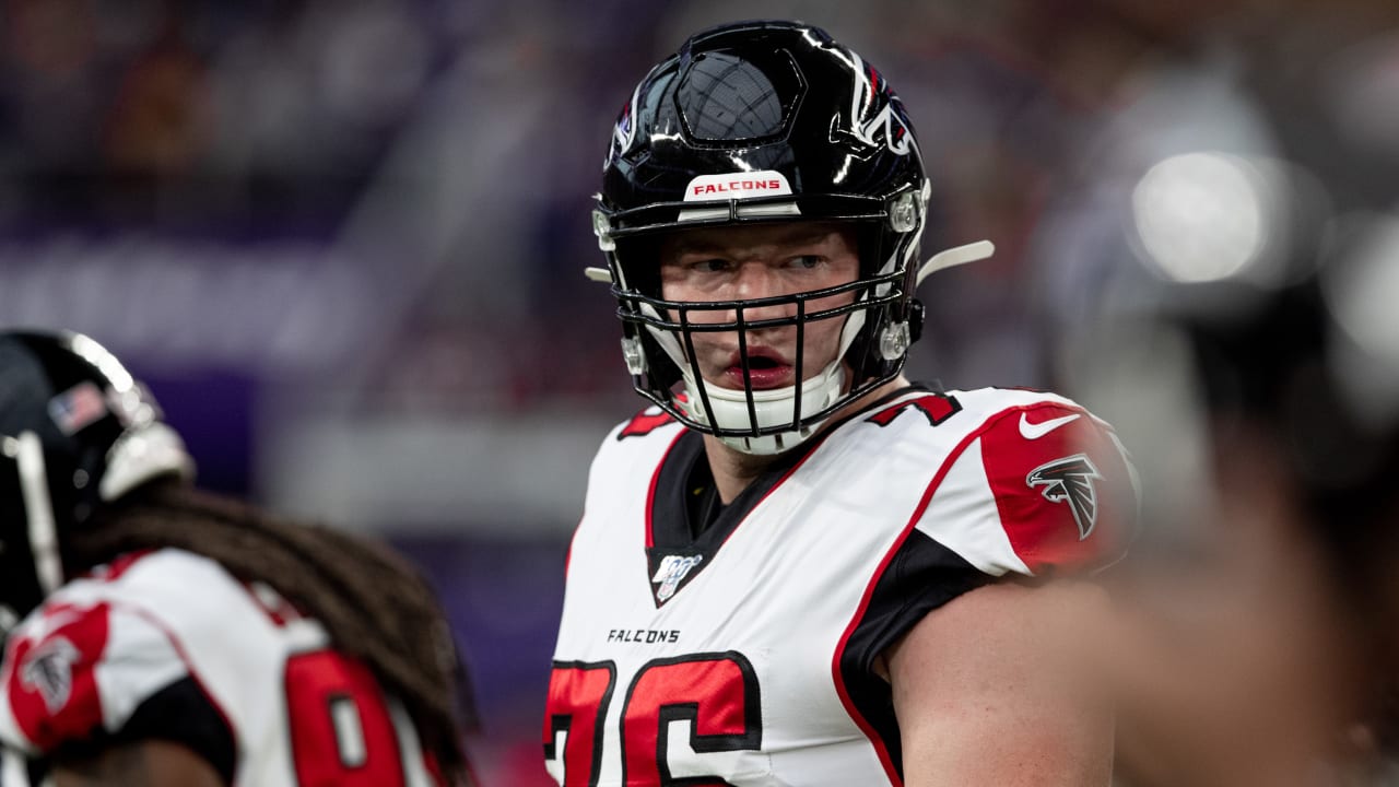 Atlanta Falcons offensive tackle Kaleb McGary (76), left, works against an  unidentifed teammate during the first day of team's NFL football training  camp pratice Wednesday, July 26, 2023, in Flowery Branch, Ga. (