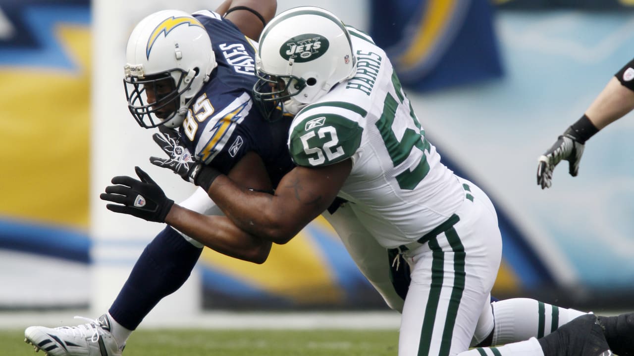 New York Jets Al Toon, dark jersey, is tackled by New England