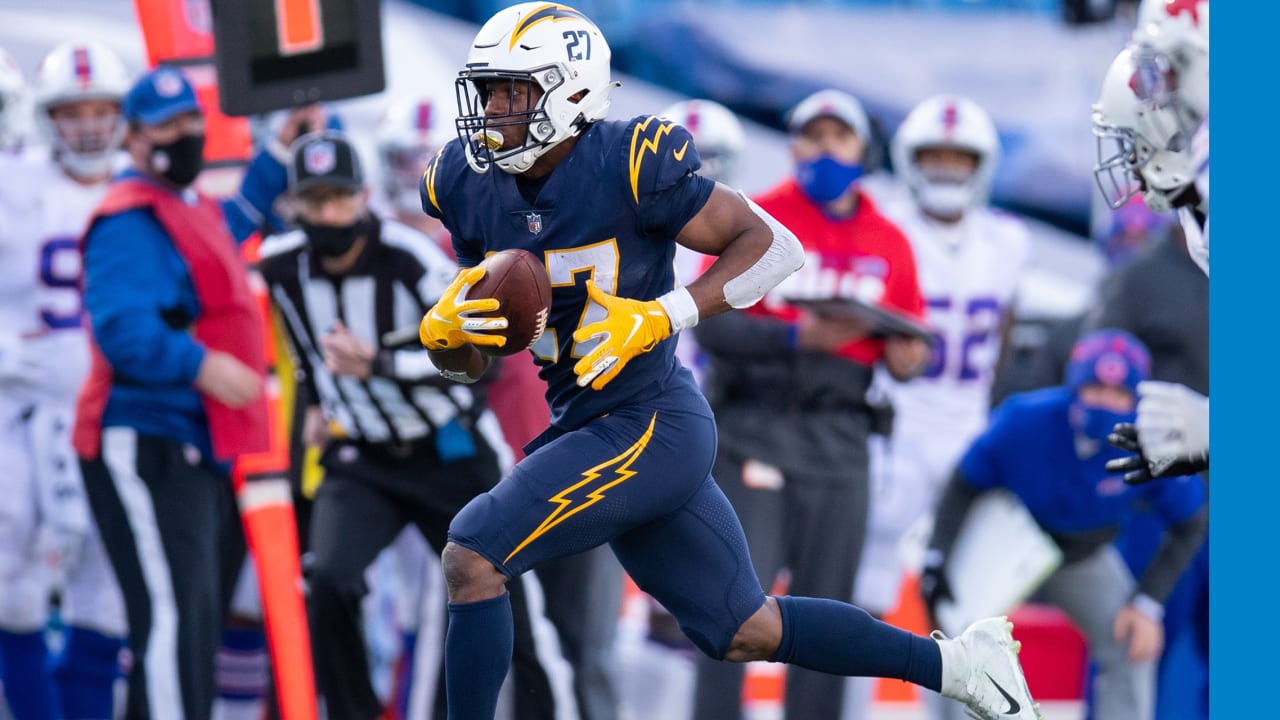 Los Angeles Chargers running back Joshua Kelley is tackled by Los