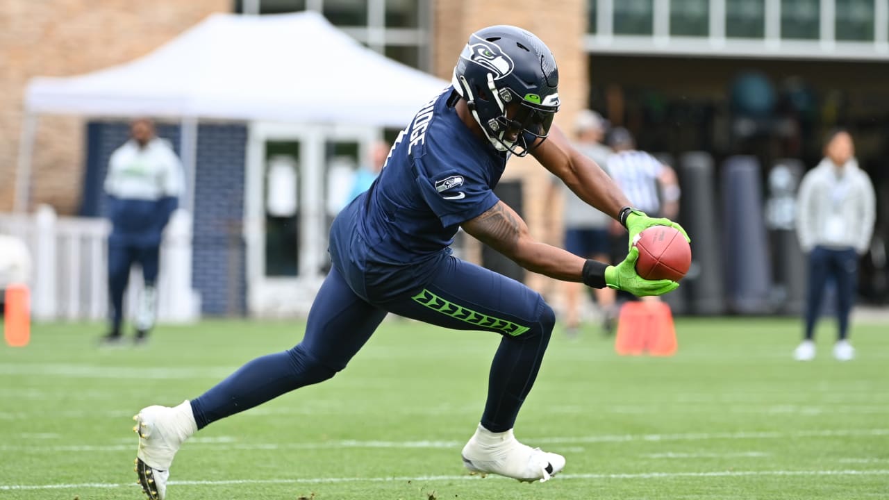 Seattle Seahawks wide receiver Dee Eskridge (1) jogs on the field