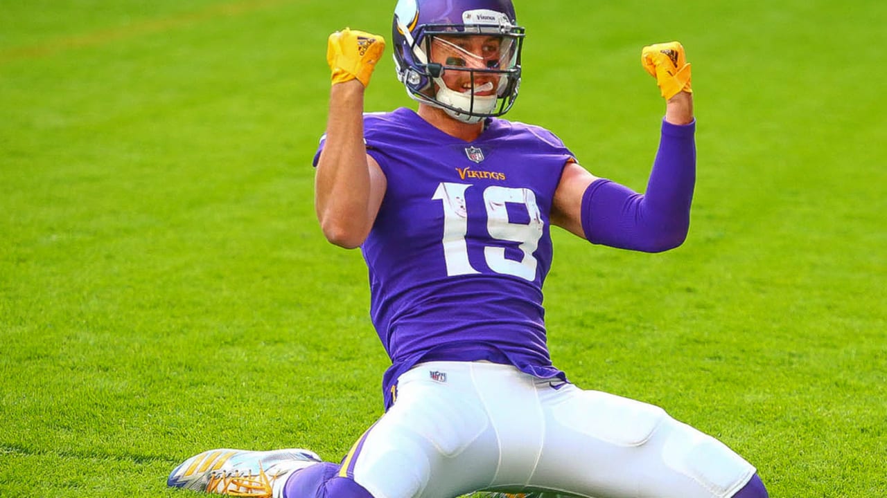 Minnesota Vikings wide receiver Adam Thielen, right, celebrates