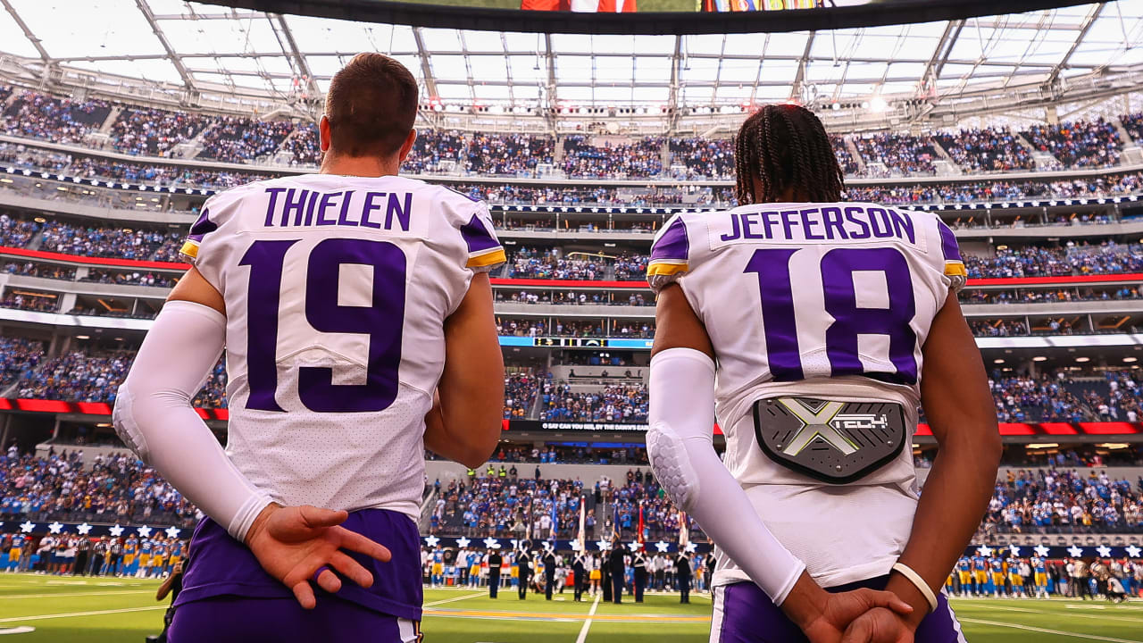 Minnesota Vikings wide receivers Justin Jefferson (18) and Adam Thielen  (19) celebrate after Jefferson scored a touchdown against the New York  Jets, during the second half of an NFL football game Sunday