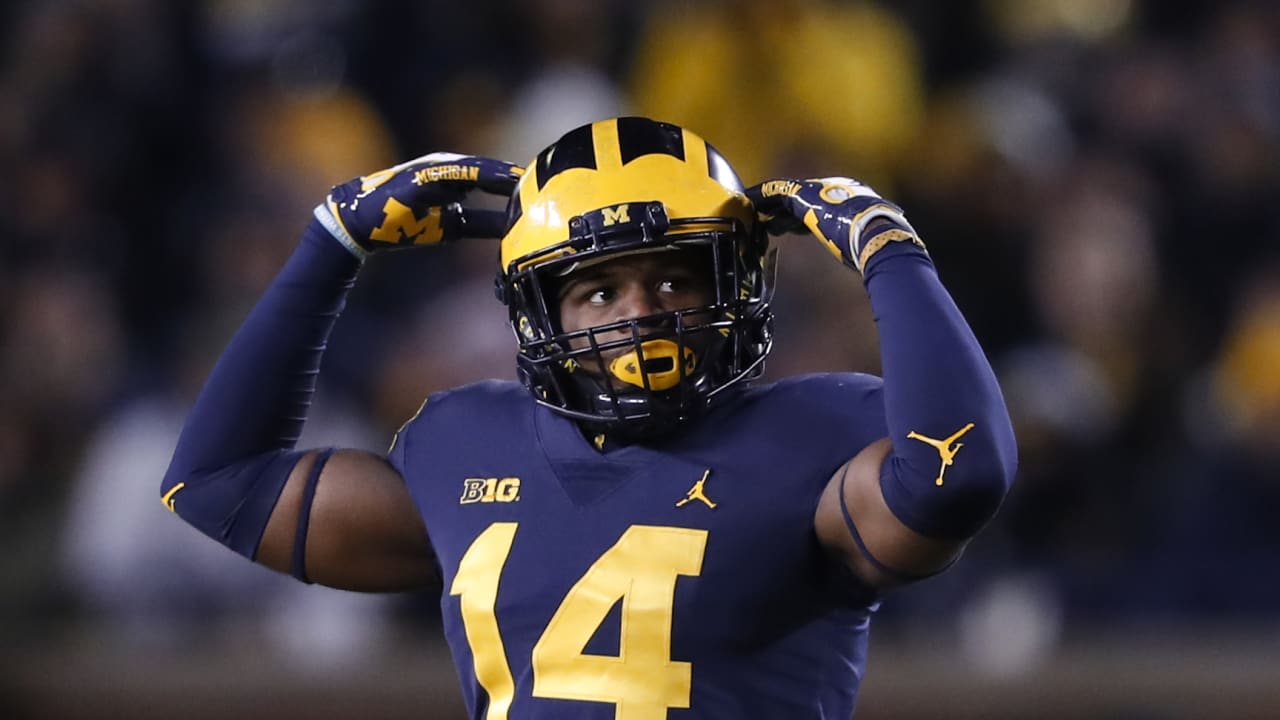 Michigan defensive back Lavert Hill (24) celebrates his interception with  linebacker Khaleke Hudson, right, in the second quarter of an NCAA college  football game against Iowa in Ann Arbor, Mich., Saturday, Oct.