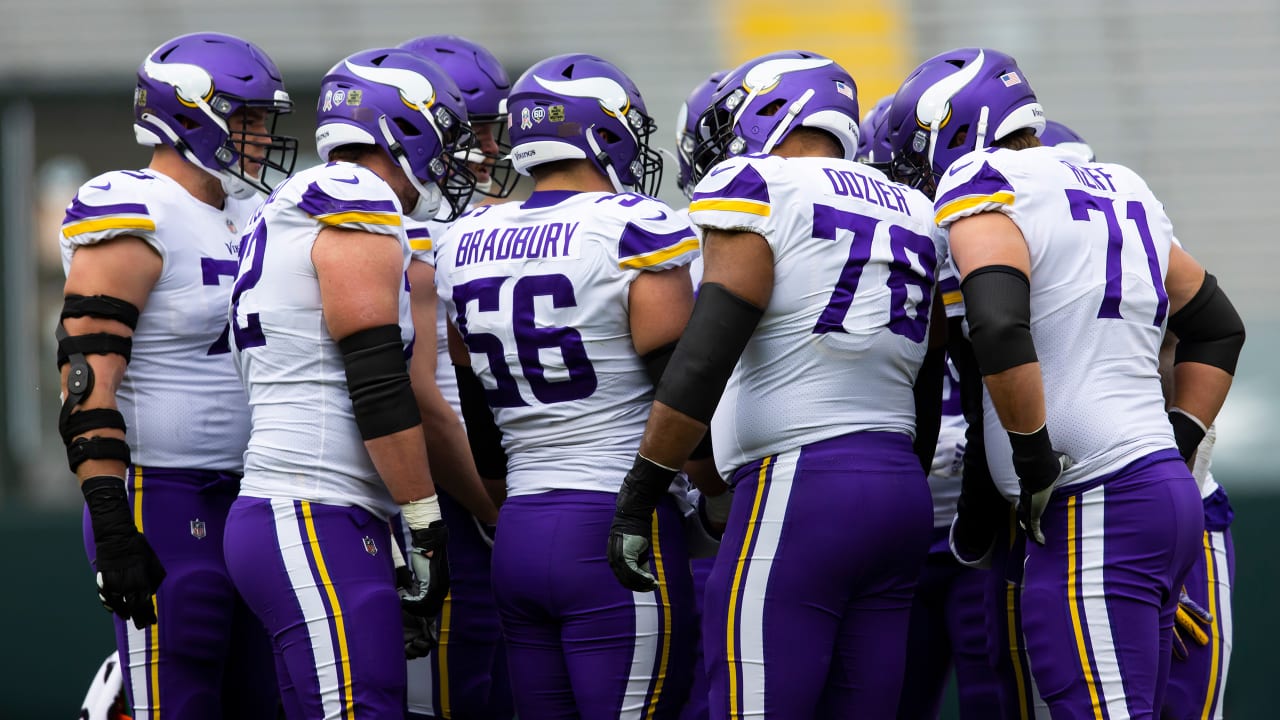 Minnesota Vikings offensive tackle Ezra Cleveland (72), right, and  offensive tackle Brian O'Neill (75) in action in the first quarter during  an NFL football game against the Atlanta Falcons, Sunday, Oct. 18