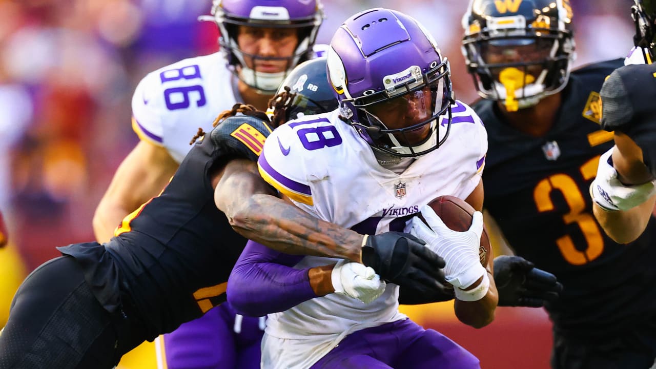 Washington Commanders cornerback Benjamin St-Juste (25) intercepts a pass  intended for Minnesota Vikings wide receiver Justin Jefferson (18) during  the second half of a NFL football game between the Washington Commanders and