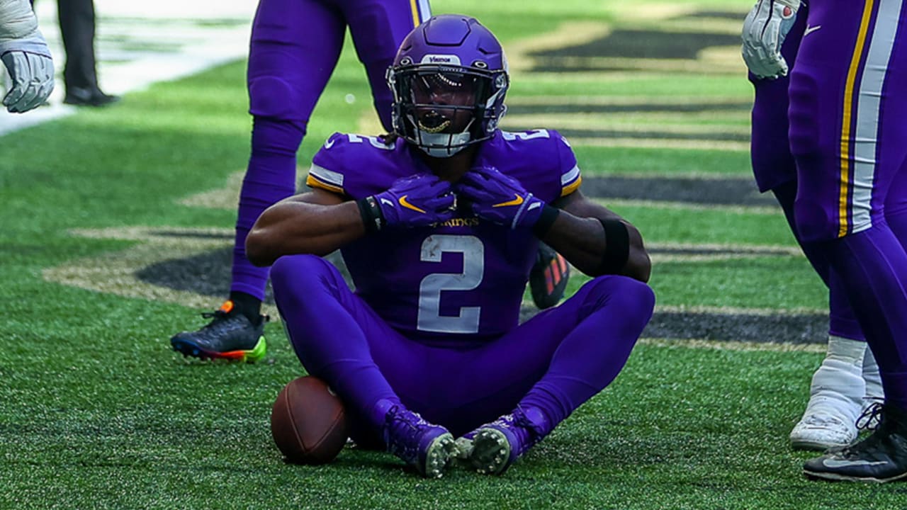 FILE - Minnesota Vikings running back Alexander Mattison (2) breaks a  tackle to score a touchdown in the first quarter of an NFL match between  Minnesota Vikings and New Orleans Saints at