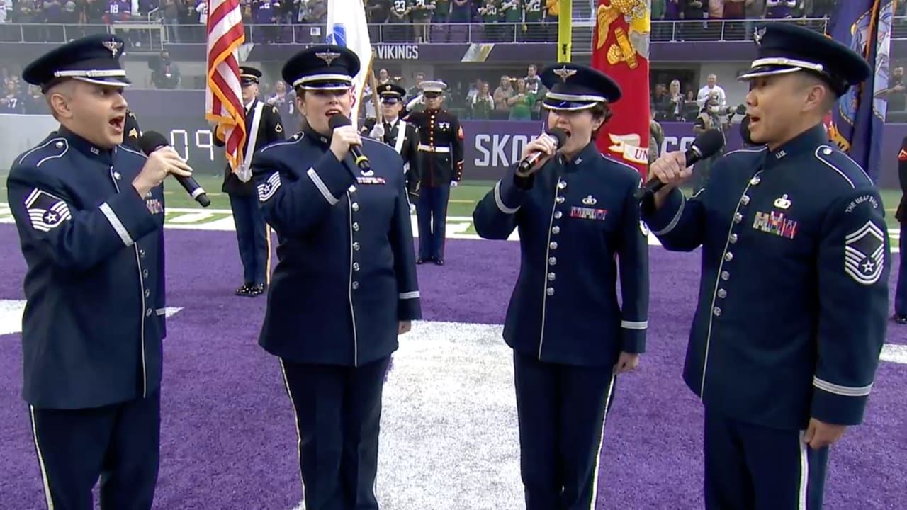 Vocalists from each military branch perform the national anthem during the  New York Jets' Salute to