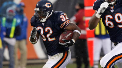 Cedric Benson of the Chicago Bears celebrates his touchdown with Rex