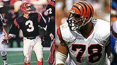 Former Cincinnati Bengals players Tim Krumrie, left, Max Montoya