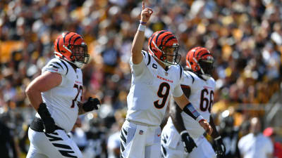 Pittsburgh Steelers running back Najee Harris (22), left, greets Cincinnati  Bengals quarterback Joe Burrow (9) after an NFL football game, Sunday, Nov.  20, 2022, in Pittsburgh. The Bengals won 37-30.(AP Photo/Don Wright