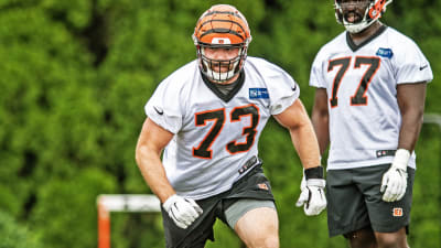 Cincinnati Bengals linebacker Logan Wilson (55) and Cincinnati Bengals  guard Hakeem Adeniji (77 …