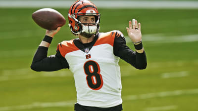 Cincinnati Bengals quarterback Joe Burrow, left, and Brandon Allen, right,  during the second half of a preseason NFL football game against the New  York Giants Sunday, Aug. 21, 2022, in East Rutherford