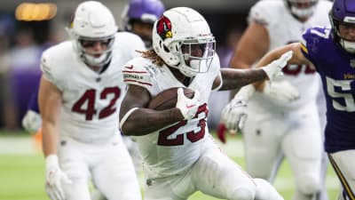 Arizona Cardinals running back Corey Clement (23) handles the ball against  Minnesota Vikings cornerback Jaylin Williams (38) during the second half of  an NFL preseason football game Saturday, Aug. 26, 2023 in