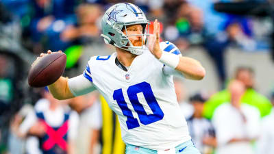 Dallas Cowboys quarterback Cooper Rush (10) hands the ball off