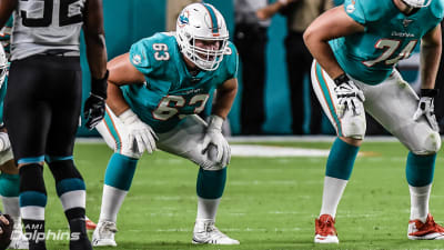 Miami Dolphins guard Michael Deiter (63) heads onto the field for warmups  before the start of a NFL preseason football game against the Las Vegas  Raiders, Saturday, Aug. 20, 2022, in Miami