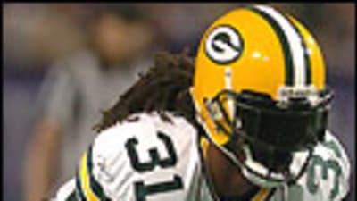 Green Bay Packers fullback Raymond Henderson is brought down by