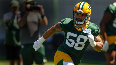 Green Bay Packers linebacker Isaiah McDuffie (58) picks up a loose ball  during an NFL football game against the Washington Commanders, Sunday, October  23, 2022 in Landover. (AP Photo/Daniel Kucin Jr Stock