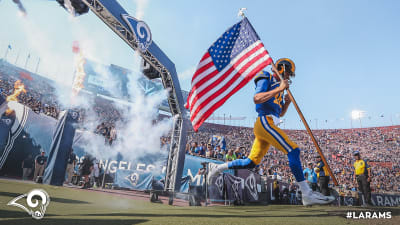 Fans wave team flags at an NFL game between the Oakland Raiders and the  Chicago Bears at Totten …