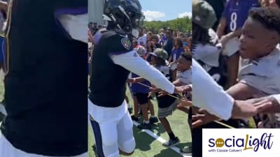 Young Ravens Fan Had Priceless Reaction to High-Fiving Lamar Jackson -  Sports Illustrated