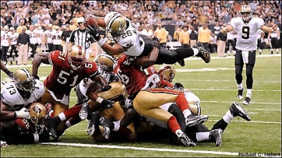 New Orleans Saints receiver David Patten (81) takes a Drew Brees pass up  the field for 26-yards before fumbling the ball away during fourth quarter  action against the Arizona Cardinals at the