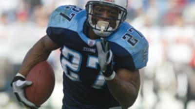 Dallas Cowboys running back Eddie George, carrying ball, prepares