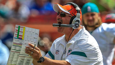 Miami Dolphins head coach Tony Soprano looks at a replay of a