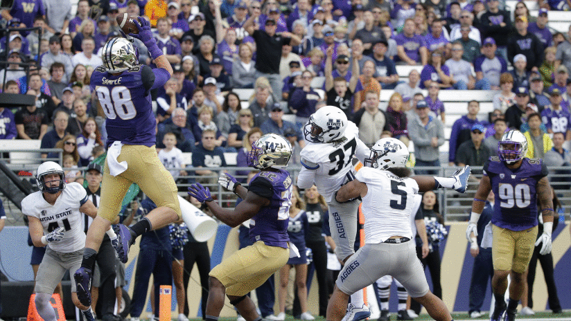 Washington tight end Drew Sample (88) catches a pass for a touchdown against Utah State as Washington's Lavon Coleman (22) looks on in the second half of an NCAA college football game, Saturday, Sept. 19, 2015, in Seattle. Washington beat Utah State 31-17. (AP Photo/Ted S. Warren)